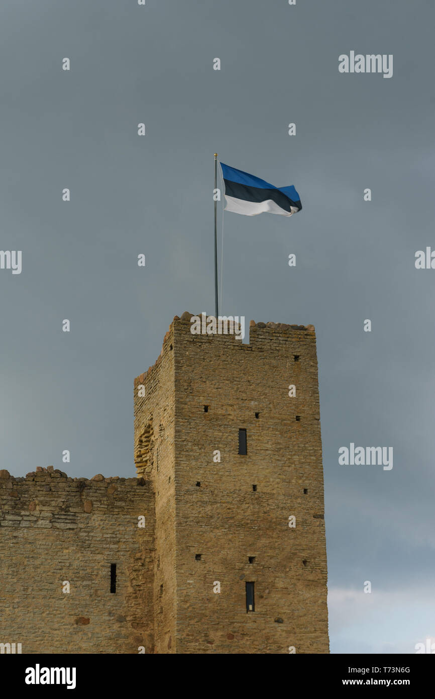 Flag of Estonia on the top of Rakvere medieval castle, Estonia Stock Photo