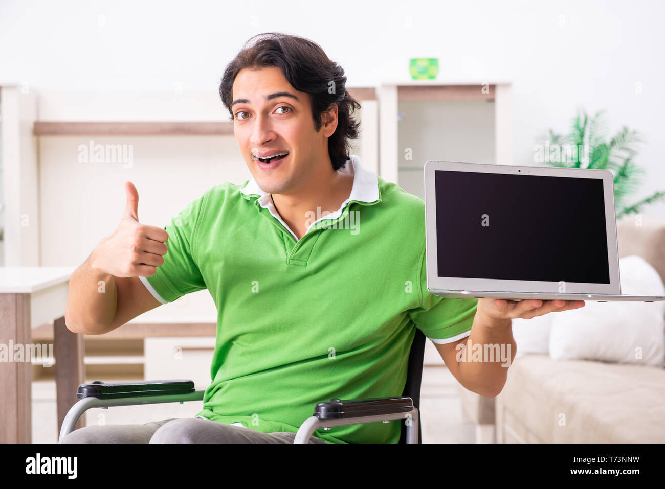 Excited young man in wheelchair hi-res stock photography and images - Alamy