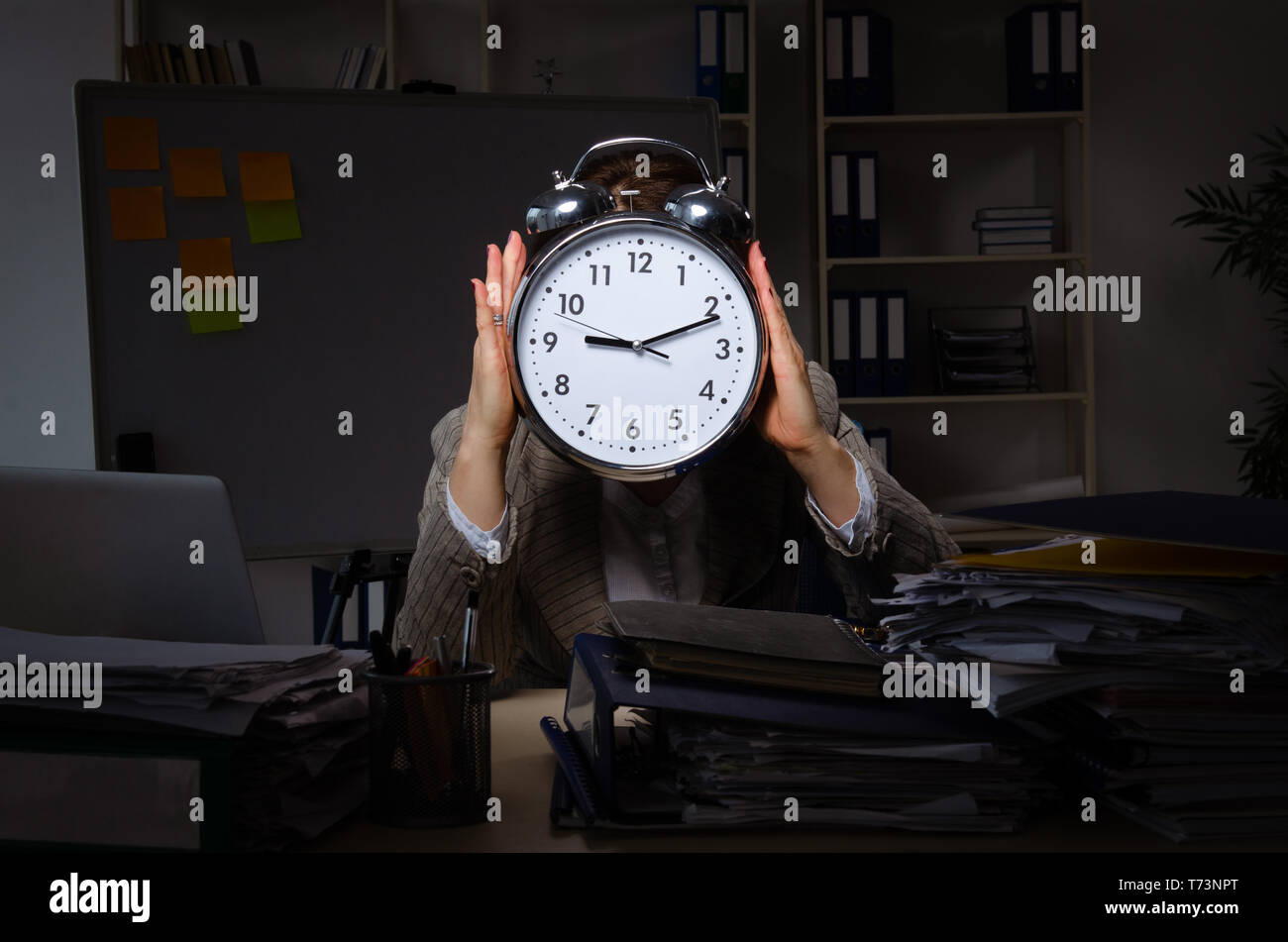 Excess Work Female employee suffering from excessive work Stock Photo - Alamy
