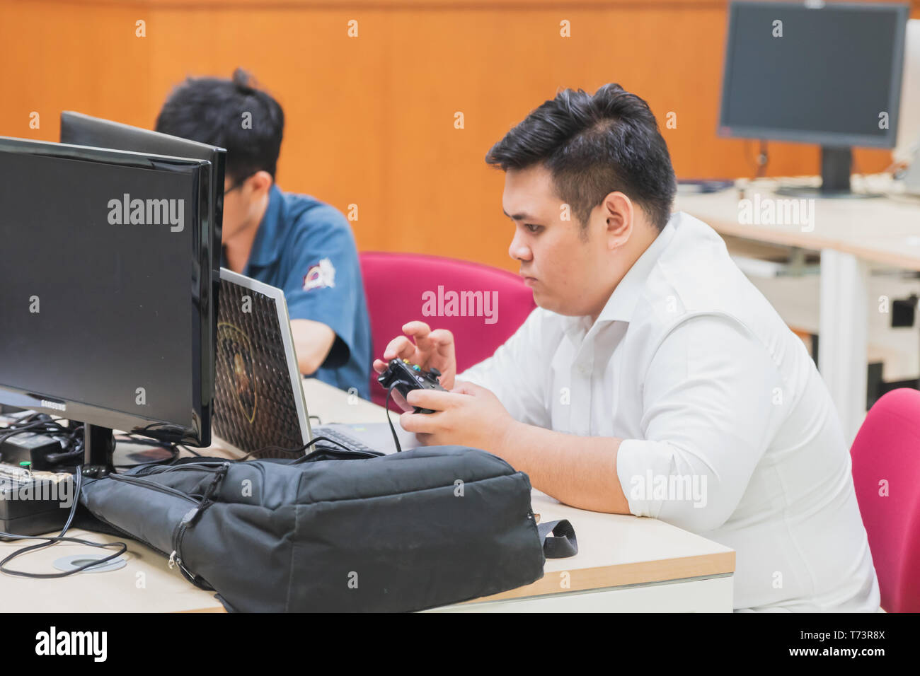 Student using mobile during class hi-res stock photography and images ...
