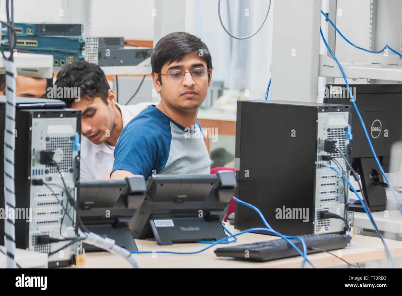 Group of Indian university computer engineering students working and ...