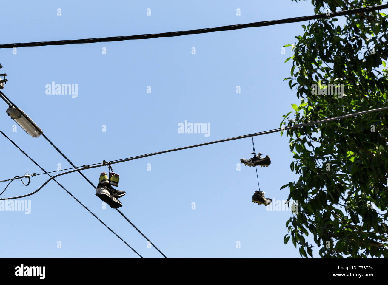 shoes on telephone line