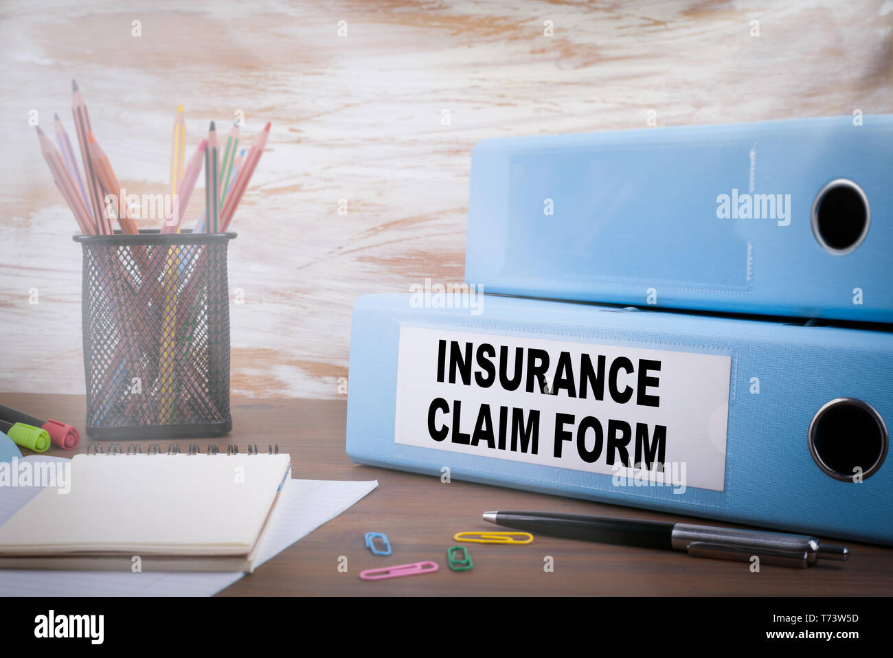 Insurance Claim Form, Office Binder on Wooden Desk Stock Photo Alamy