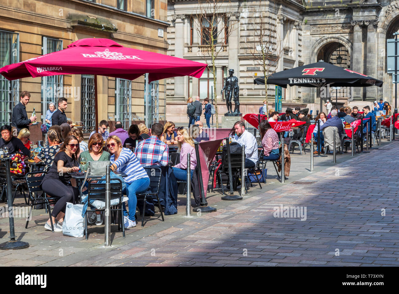 Customers eating outdoors at restaurants and cafes in Glasgow's Italian centre, John Street, Glasgow, Scotland, UK Stock Photo