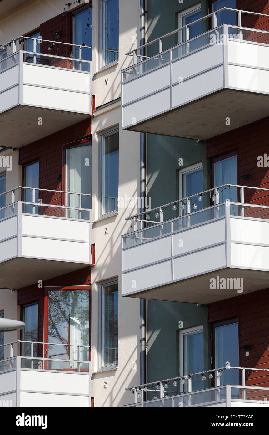 Exterior of a modern multi story multi family apartment residential building with balconies. Stock Photo