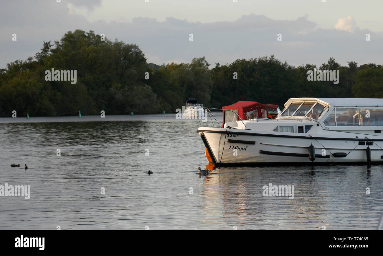 Broads Motor Cruiser Moored on the Tranquil Malthouse Broad, at Ranworth, on The Norfolk Broads, Ranworth, Norfolk, England, UK Stock Photo