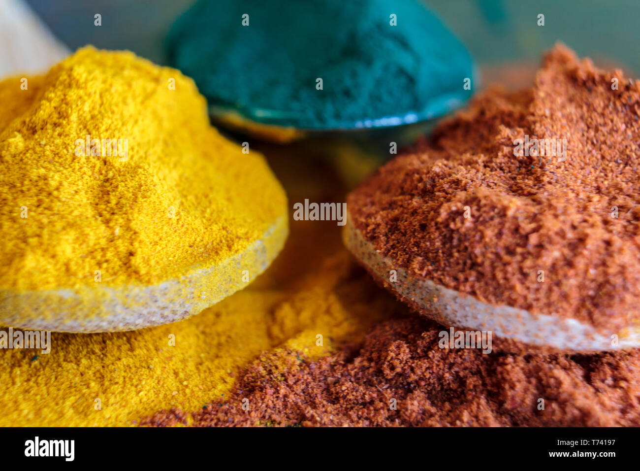 Pile of cayenne pepper, turmeric powder and spirulina Stock Photo Alamy