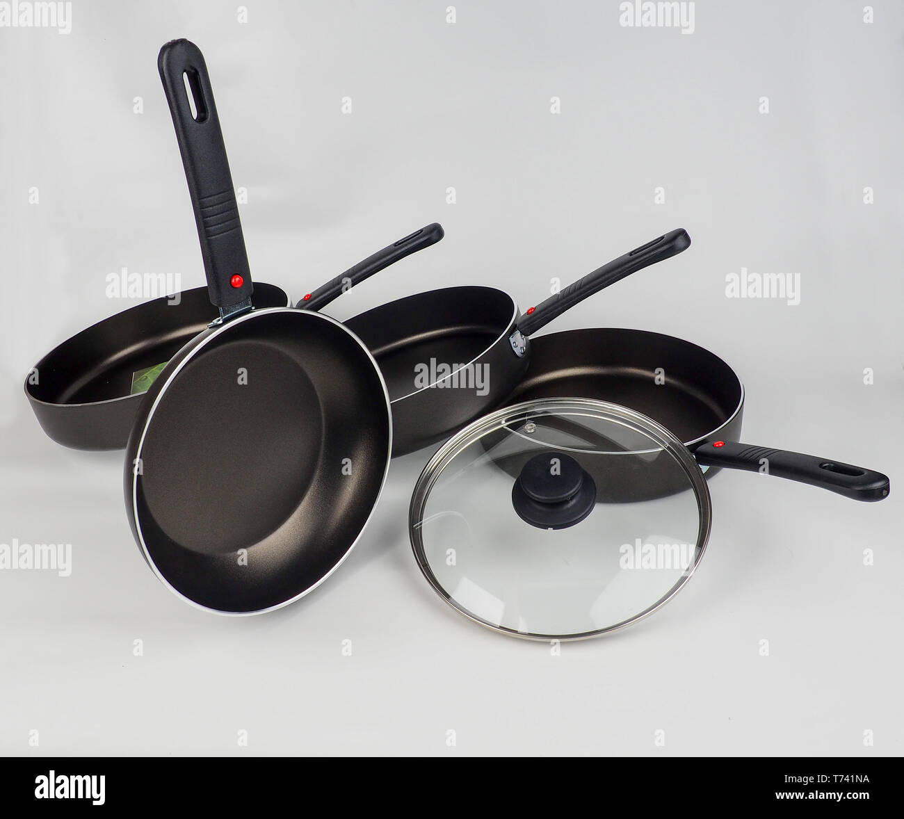 Cooking Pot and Frying Pans on White Background. Stock Photo