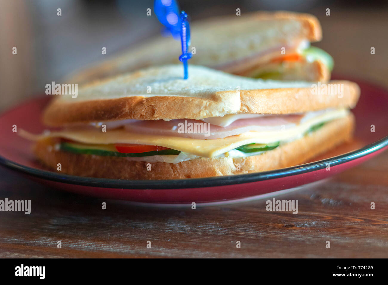 Closeup photo of a club sandwich. Sandwich with meet, prosciutto