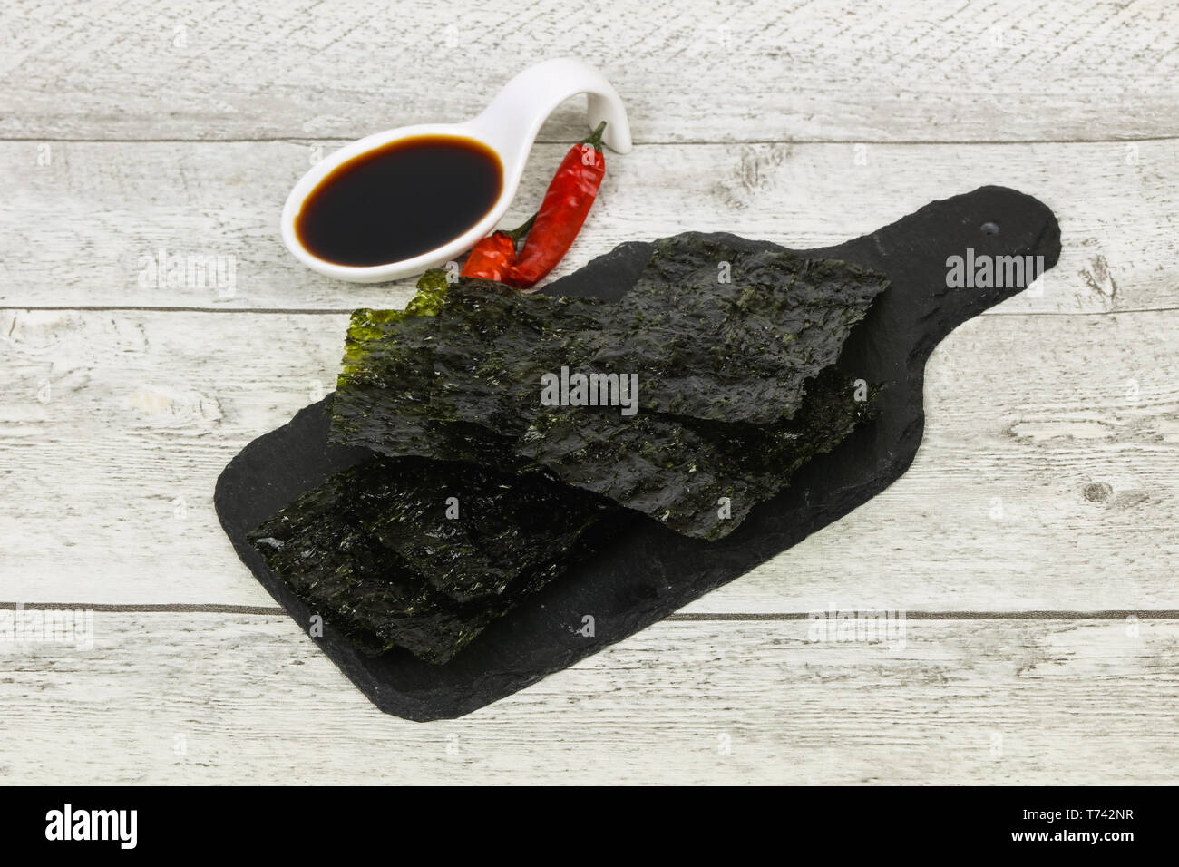 Tasty Nori chips with soya sauce Stock Photo Alamy