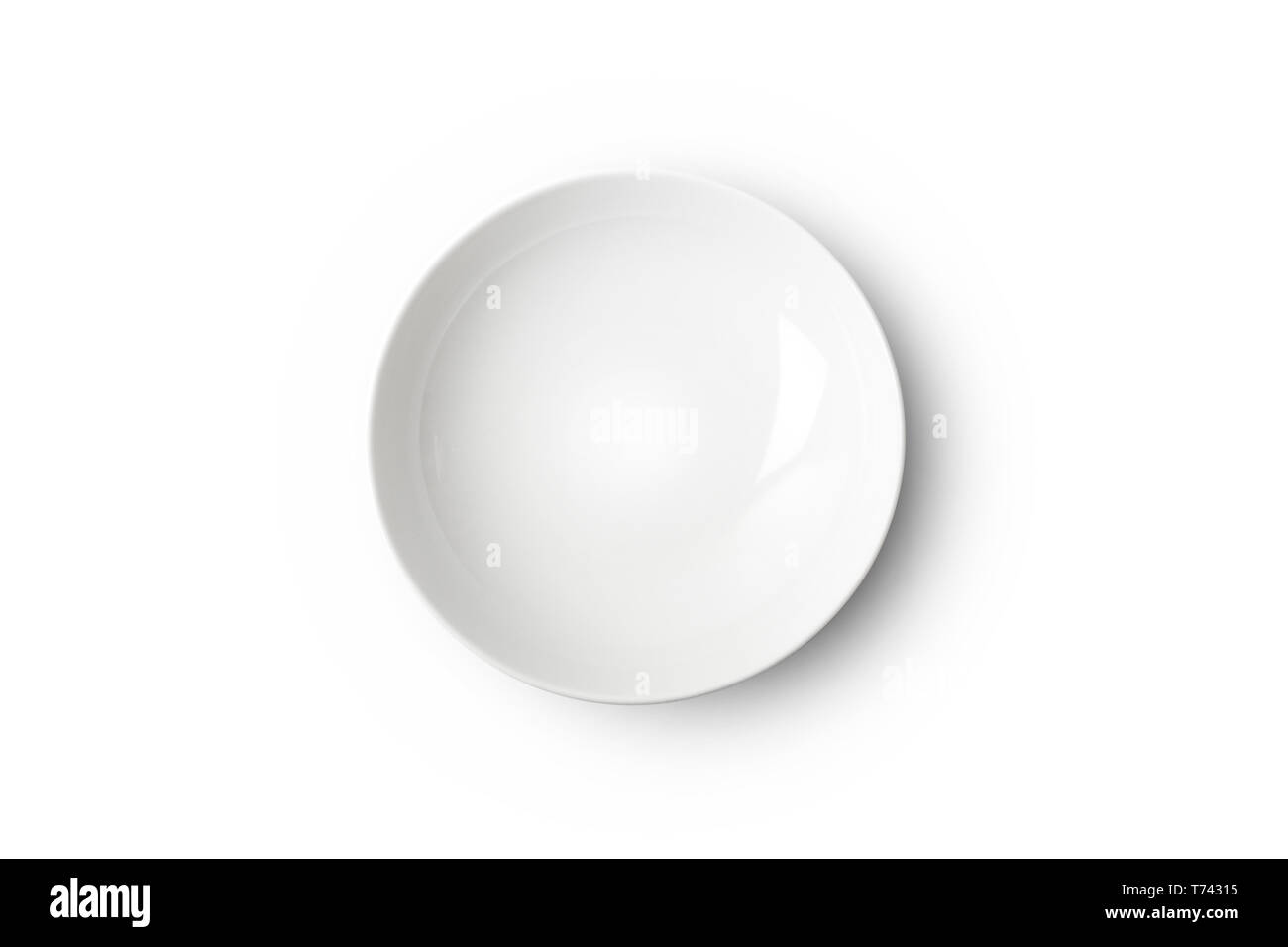 Empty white ceramic plate. Isolated on white background with clipping path Stock Photo