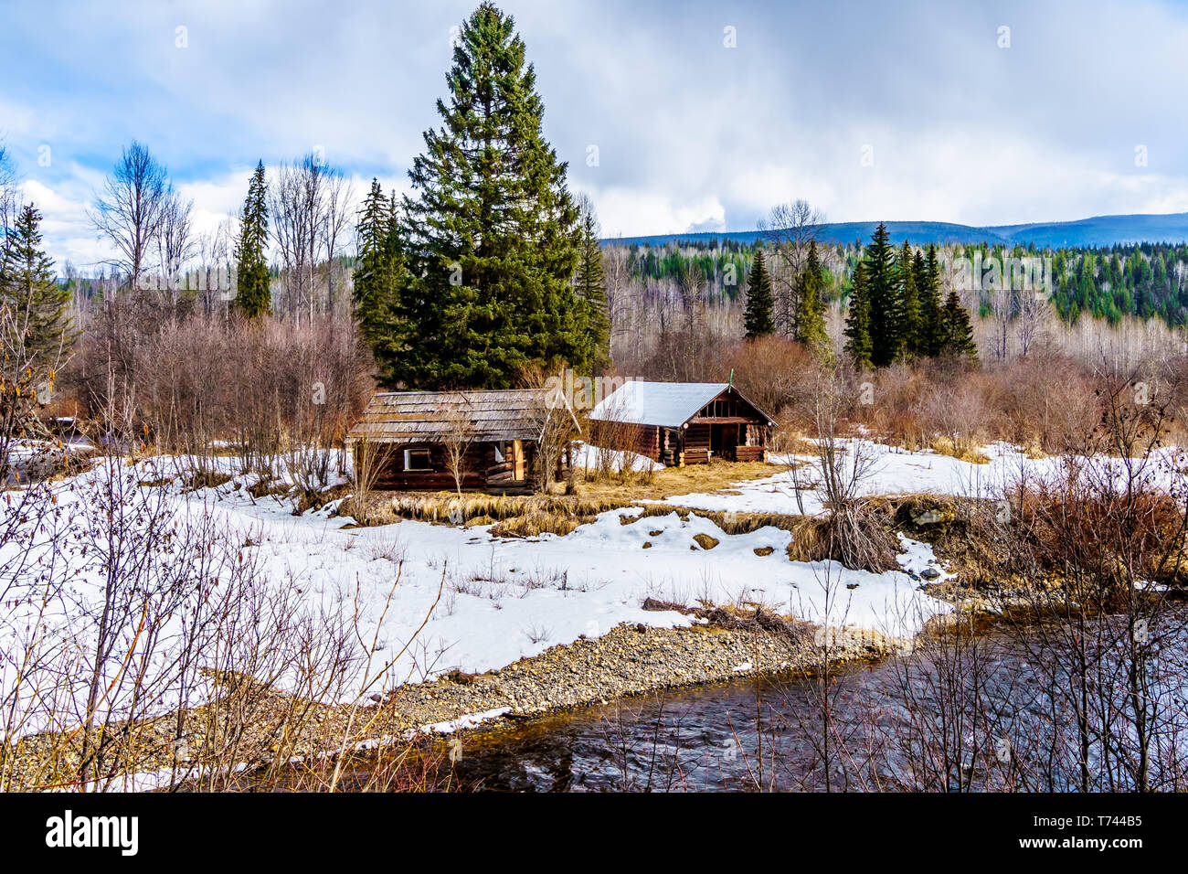 Old huts along the snow and ice lined creeks in winter time Wells Gray Provincial Park in the Cariboo Mountains of British Columbia, Canada Stock Photo