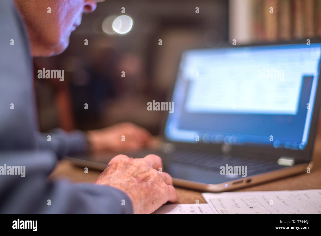Old man of 93 years having trouble using his computer to check his ...