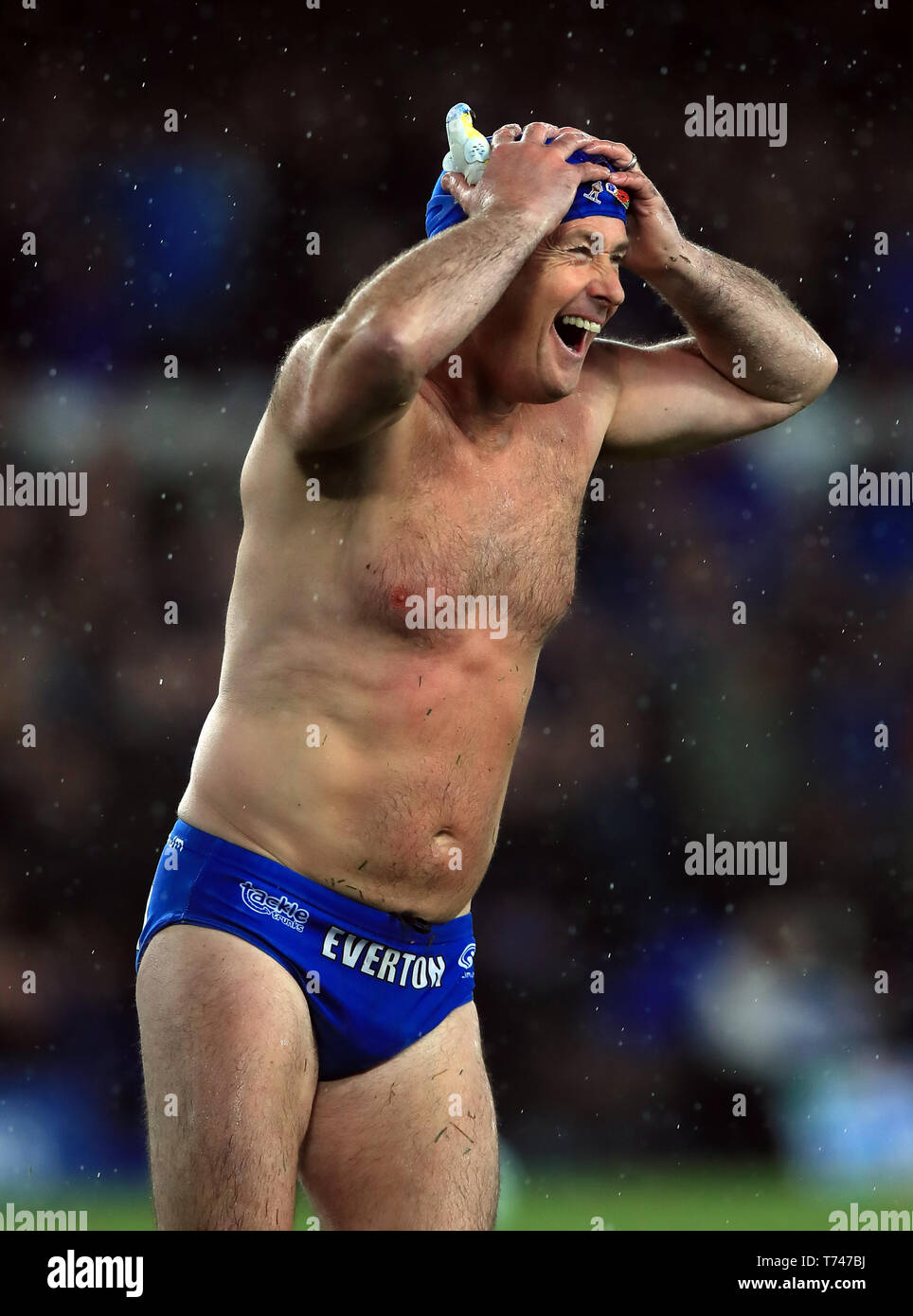 Speedo Mick on the pitch at half time of the Premier League match at  Goodison Park, Liverpool Stock Photo - Alamy