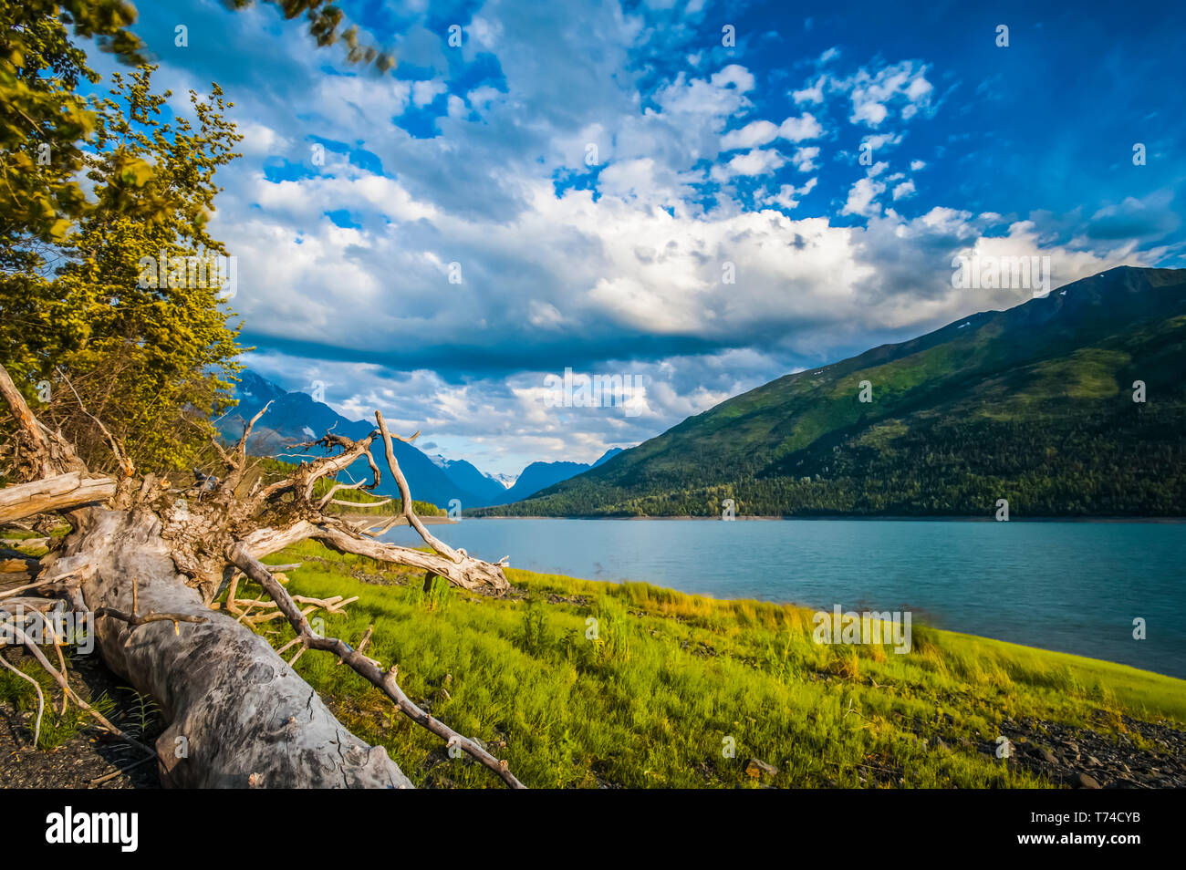 Clouds floating over Eklutna Lake on a mid-summer day in the Chugach State Park, near Anchorage; Alaska, United States of America Stock Photo
