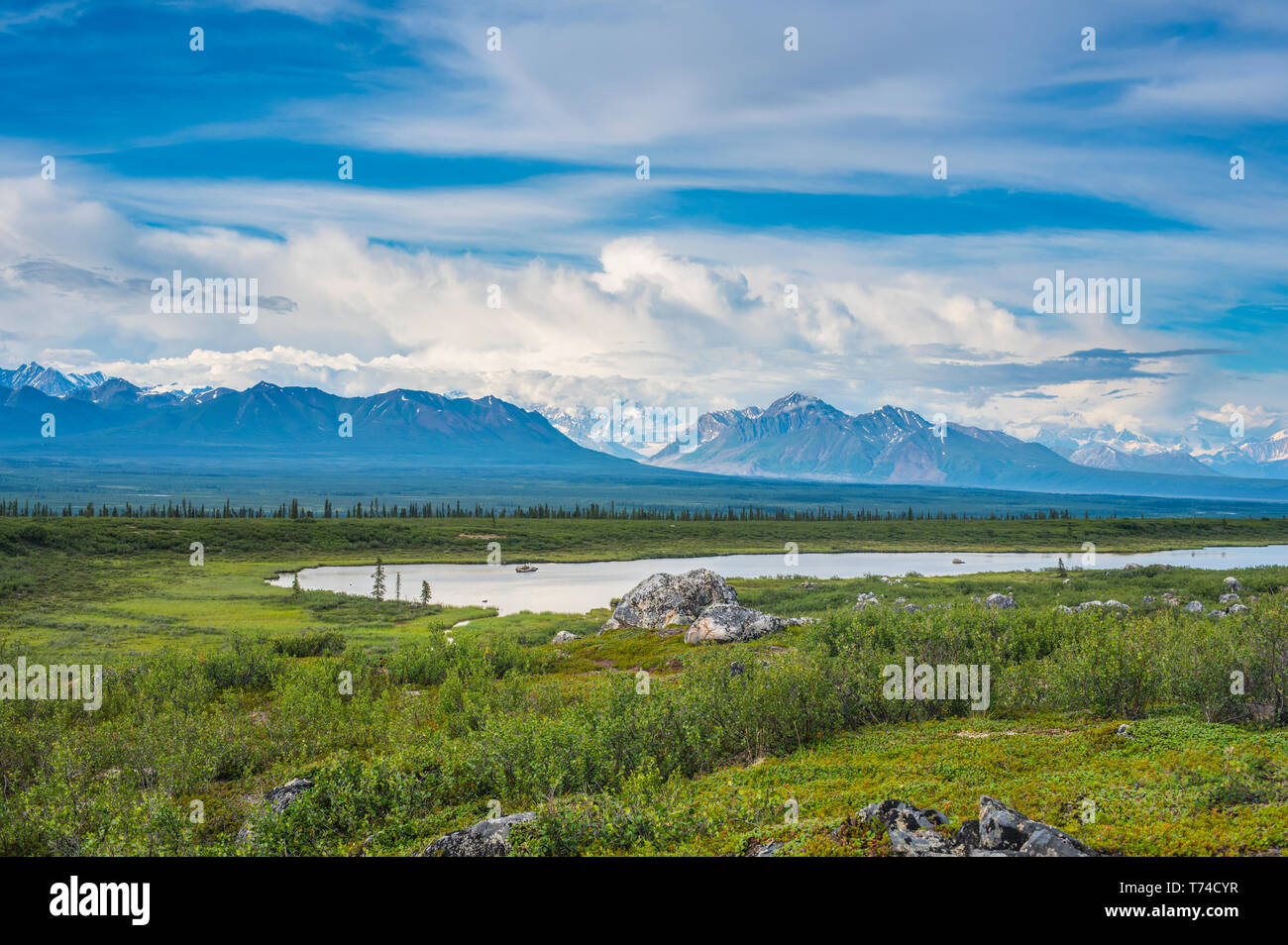 Summer clouds over the Alaska Range as seen from the Alaska Highway in South-central Alaska on a summer's day; Alaska, United States of America Stock Photo