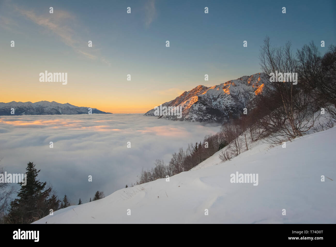 Winter fog flowing into the Cook Inlet as seen from the Bird Ridge ...