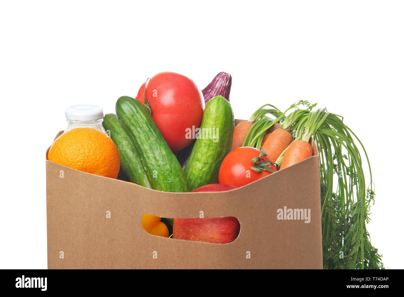 Paper bag with fresh fruits and vegetables on white background. Healthy ...