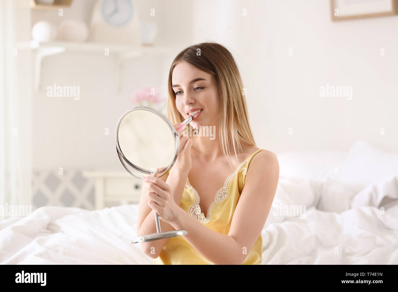 Woman in pyjamas applying hi-res stock photography and images - Alamy