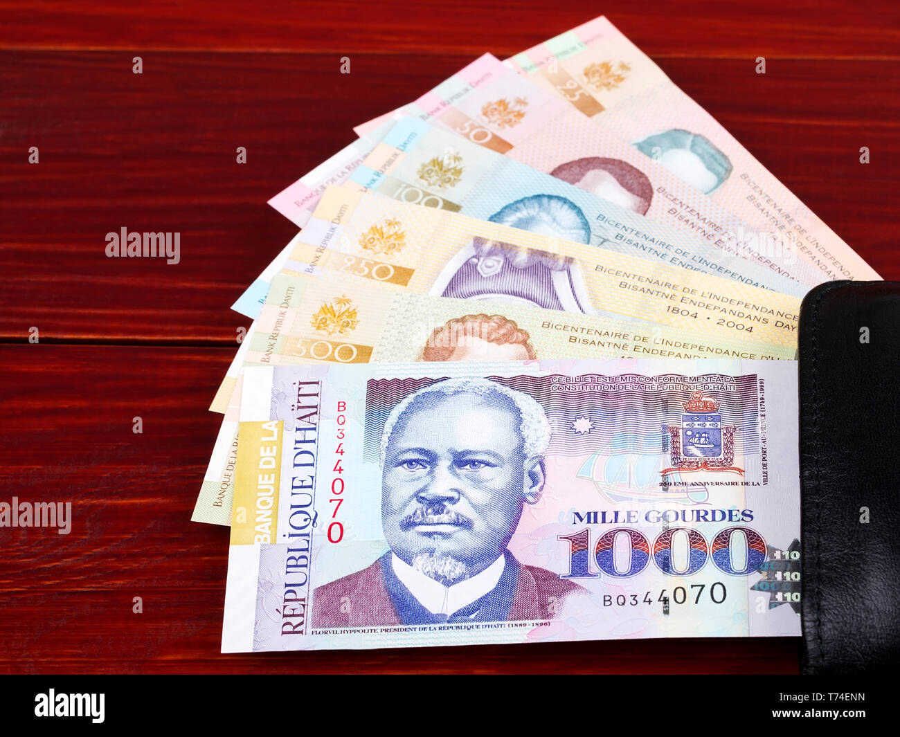 Haitian money in the black wallet Stock Photo Alamy