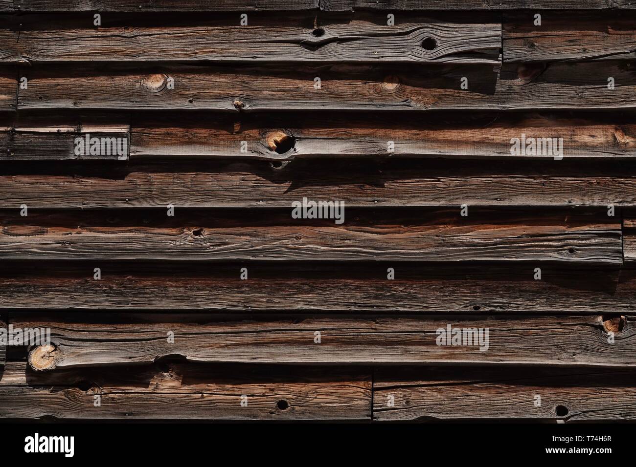 A old wood wall on the side of a cabin. Stock Photo