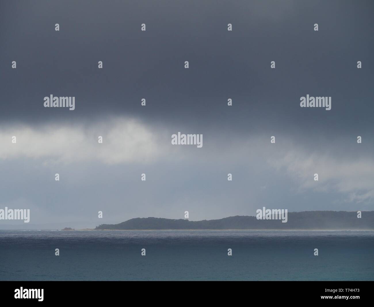 Dark looming grey storm clouds hi-res stock photography and images - Alamy