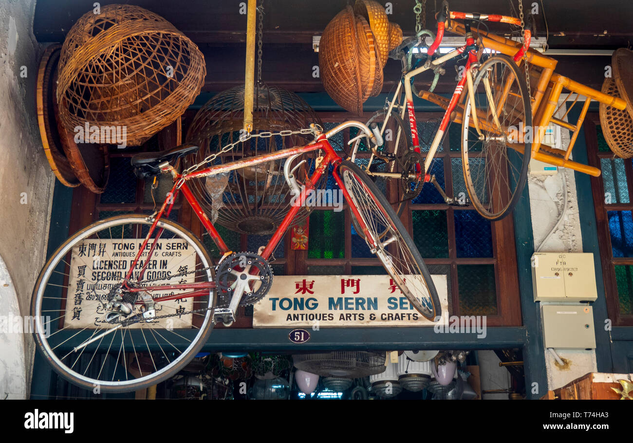 Secondhand goods for sale in an antique store in a traditional shophouse in Singapore. Stock Photo