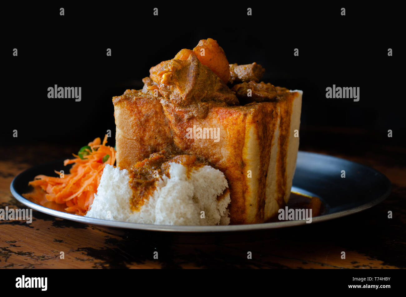A Durban Bunny Chow or, in this case, a quarter mutton bunny served with sambals. This is an