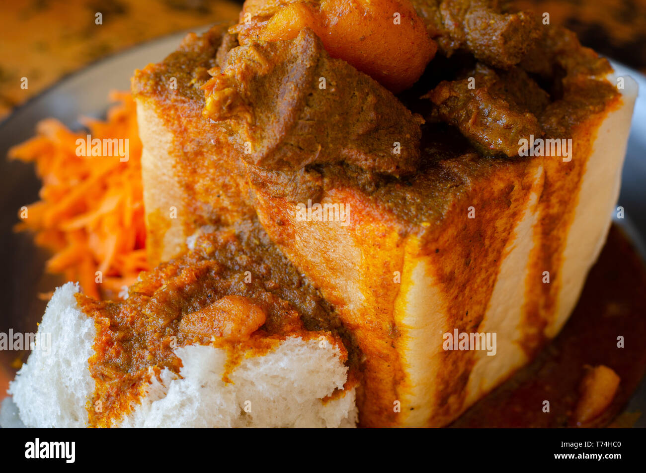 A Durban Bunny Chow or, in this case, a quarter mutton bunny served with sambals. This is an