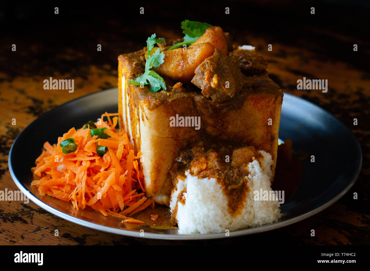 A Durban Bunny Chow or, in this case, a quarter mutton bunny served with sambals. This is an