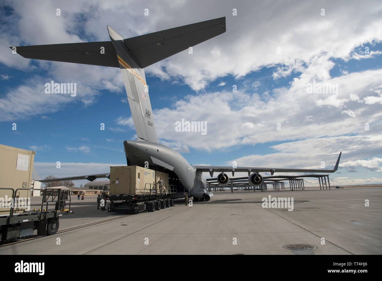 A C-17 Globemater III is being loaded with a Rapid Assistance Support for Calibration (RASCAL) unit to deploy to Joint Base Pearl Harbor - Hickam, Hawaii Jan. 17, 2019, from Mountain Home Air Force Base. The Air Force only has two RASCALs capable of deployment. (U.S. Air Force photo by Airman First Class Andrew Kobialka) Stock Photo