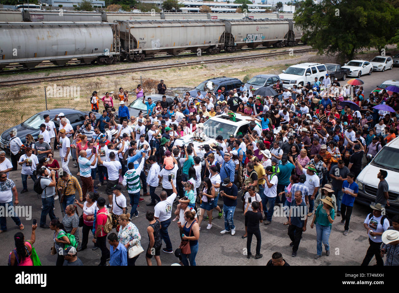 Culiacan, Mexico. 03rd May, 2019. Followers of Jesus Malverde, who is considered a saint of drug bosses in Mexico, take part in a procession. On the occasion of his 110th anniversary of death on 03.05.2019 numerous faithful gathered in his native town in the federal state of Sinaloa. Malverde, who is not recognized as a saint by the Catholic Church, is said to have been a highwayman during his lifetime. Many Mexicans worship him as a kind of Robin Hood. According to oral tradition, he robbed the rich families in the Sinaloa region and then distributed the booty among the poor. Credit: dpa pict Stock Photo