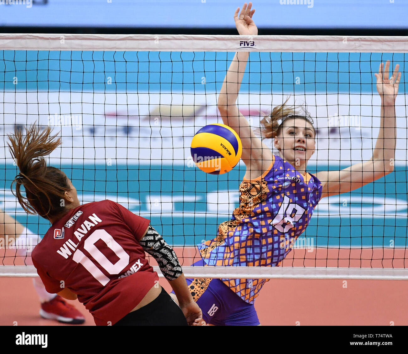 Tianjin. 4th May, 2019. Kristina Anikonova (R) of Altay VC competes during the semifinal match between Supreme Chonburi of Thailand and Altay VC of Kazakhstan at the 2019 Asian Women's Club Volleyball Championship in north China's Tianjin Municipality on May 4, 2019. Supreme Chonburi won 3-0. Credit: Li Ran/Xinhua/Alamy Live News Stock Photo