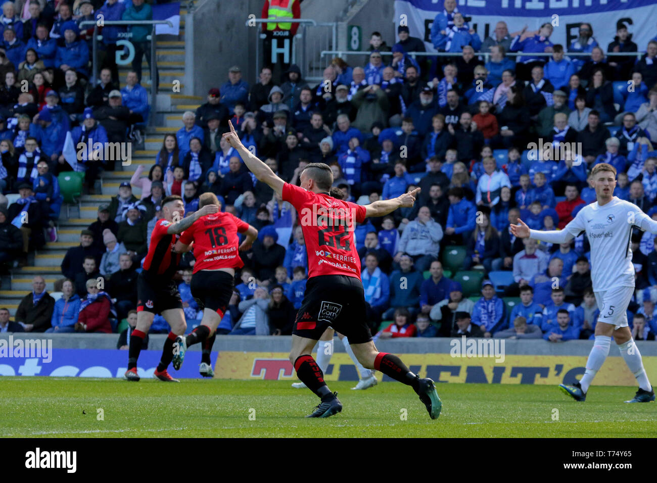 National Football Stadium at Windsor Park, Belfast, Northern, Ireland. 04th May, 2019. Tennent's Irish Cup Final - Ballinamallard United (white) v Crusaders. Action/coverage from today's cup final. Jordan Owens (18) celebrates his early goal. Credit: David Hunter/Alamy Live News Stock Photo