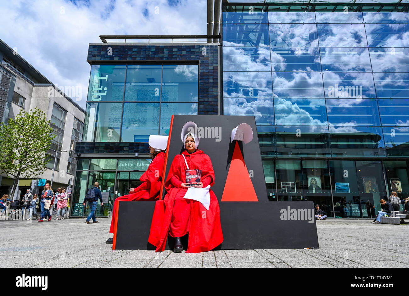 Brighton UK 4th May 2019 - The Handmaids Tale audio can be heard in Jubilee Square at the Brighton Festival Fringe 'Streets of Brighton' event in the city centre on the opening day. Credit: Simon Dack / Alamy Live News Stock Photo