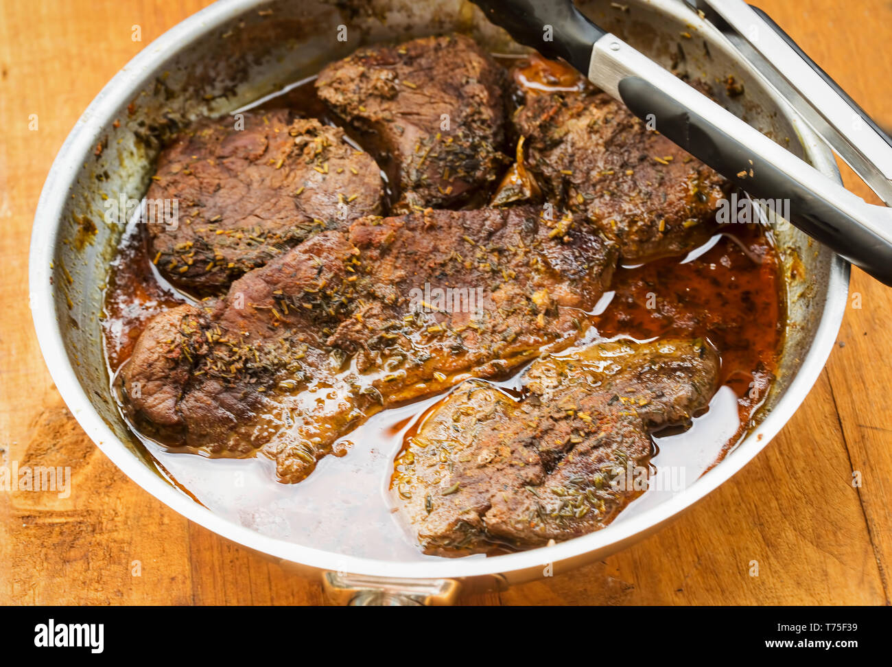 Braised beef steak in red wine Stock Photo Alamy
