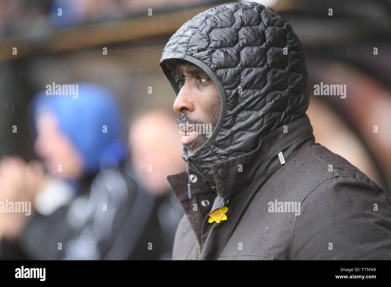 Burslem, Stoke-On-Trent. 27th April, 2019. Macclesfield Town manager Sol Campbell in the dugout at Port Vale's Vale Park. Stock Photo
