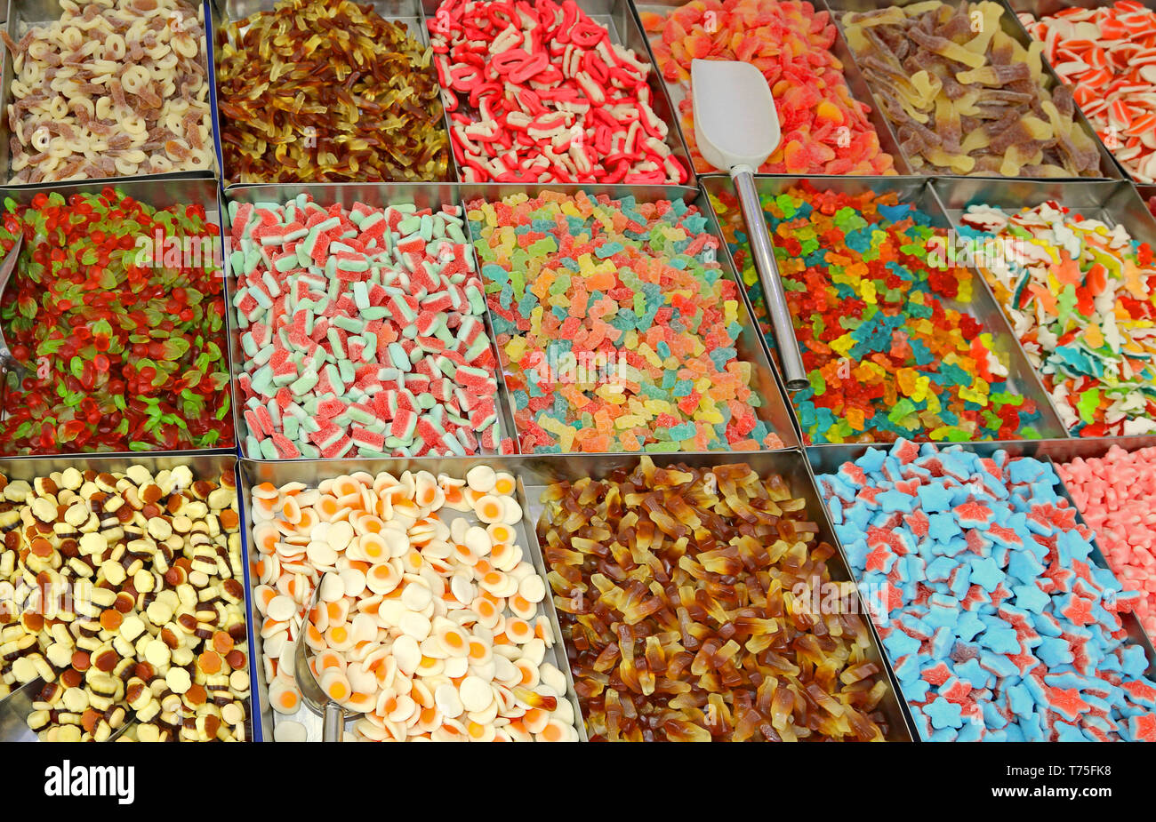 many sugary colored candies for sale in the candy store Stock Photo