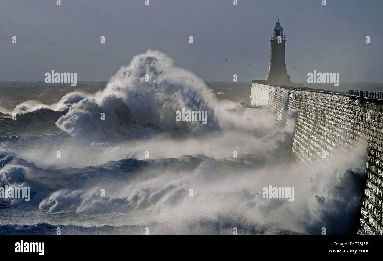 Waves crash over sea wall tynemouth hires stock photography and images