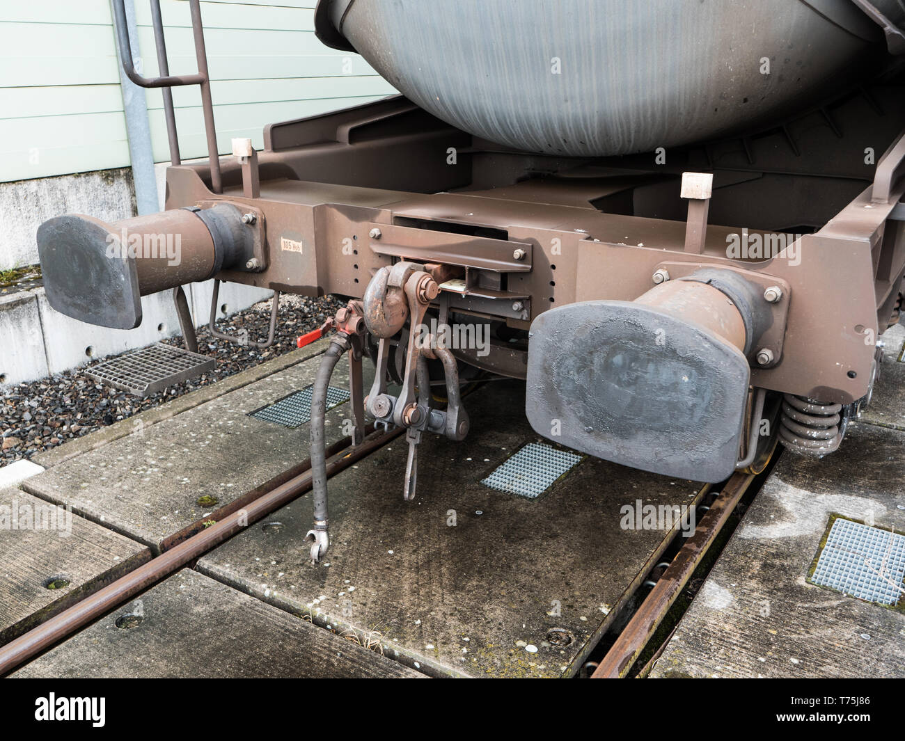 Buffers and Chain Coupler on a Standard Gauge Railway Wagon Painted Brown Stock Photo