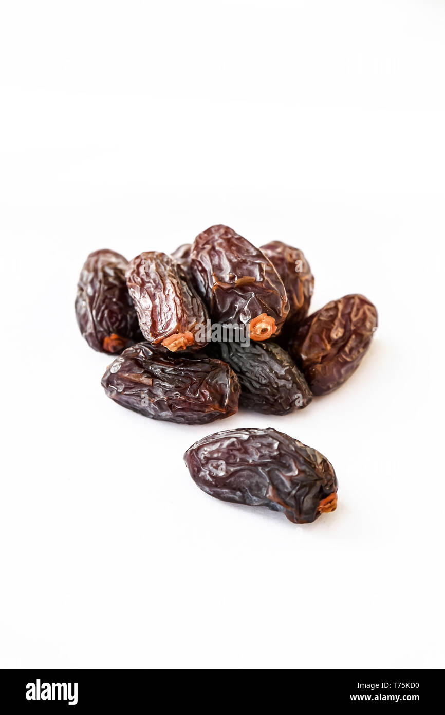 A group of king or golden Medjool date palms isolated in a white