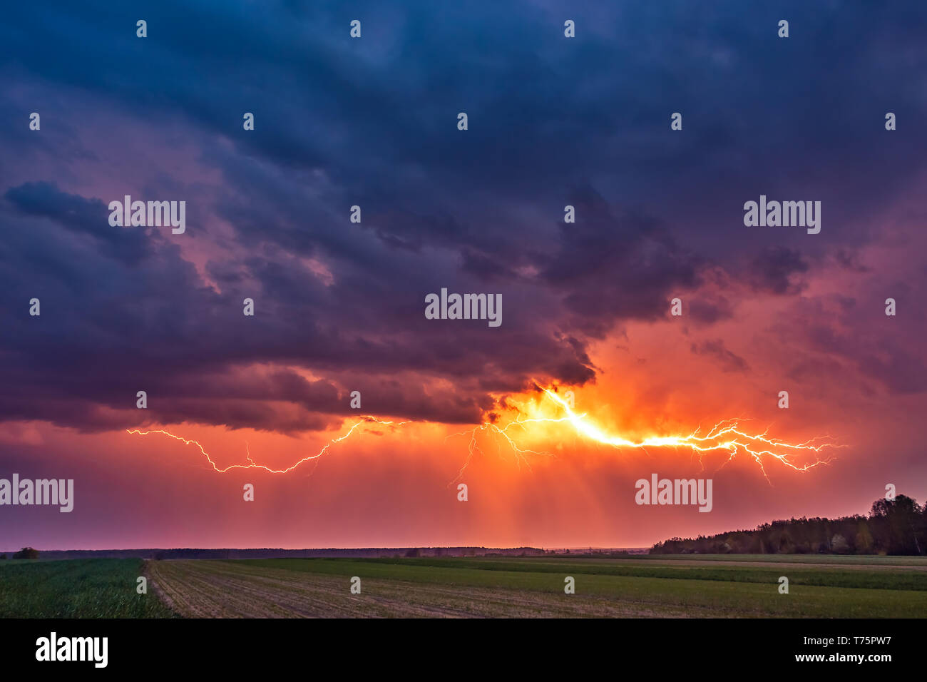 Lightning with dramatic clouds image . Night thunder-storm in Lithuania Stock Photo