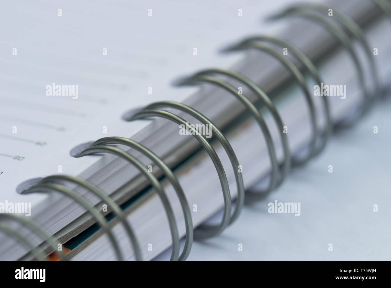 open spiral notebook macro selective focus Stock Photo