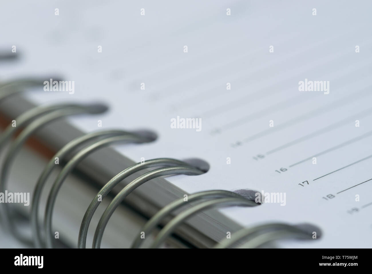 open spiral notebook macro selective focus Stock Photo
