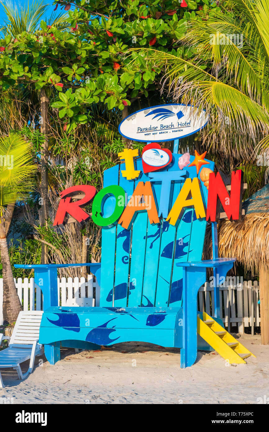 Beachside attraction an oversized beach chair on West Bay Beach Roatan Honduras. Stock Photo