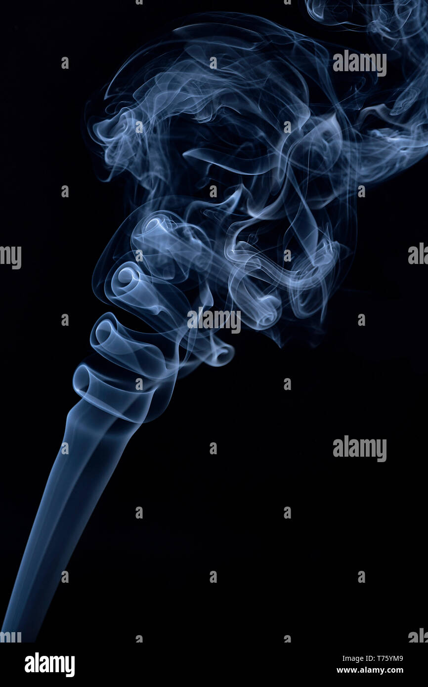 Figure abstract de smoke blue on black background Stock Photo - Alamy