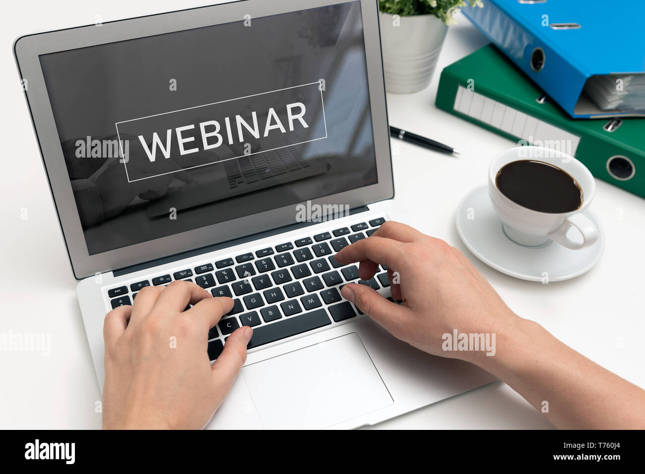 Webinar online, internet education, e-learning concept. Man typing on laptop keyboard. Stock Photo