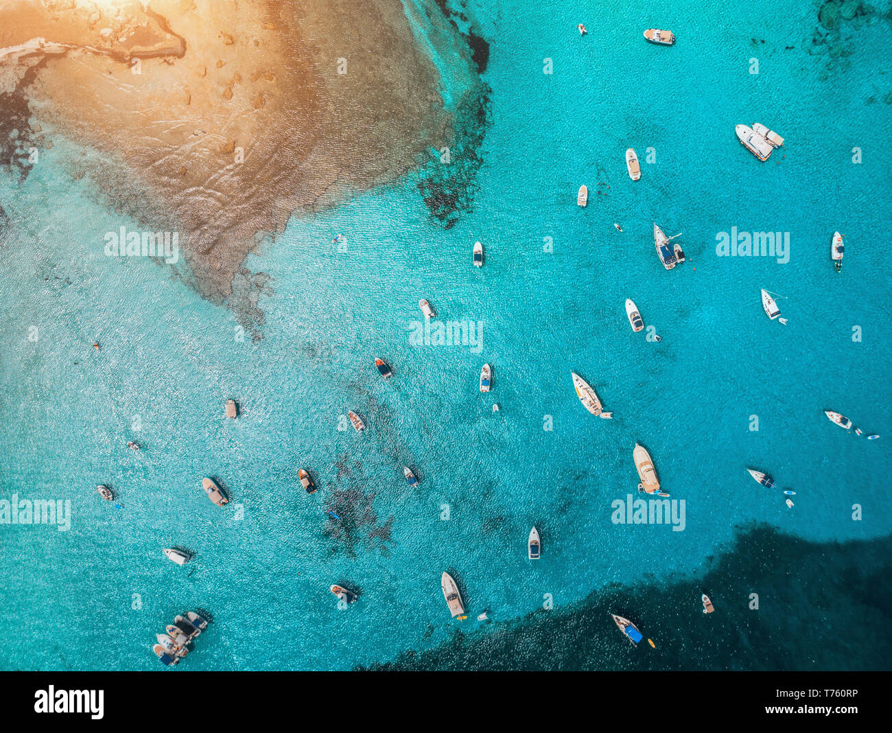 Aerial view of boats and luxury yachts in transparent blue sea at ...