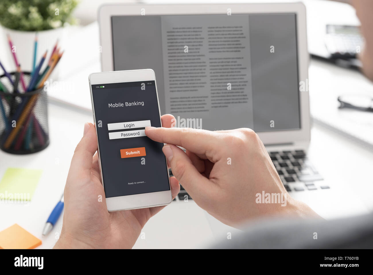 Man using mobile banking application on smartphone Stock Photo
