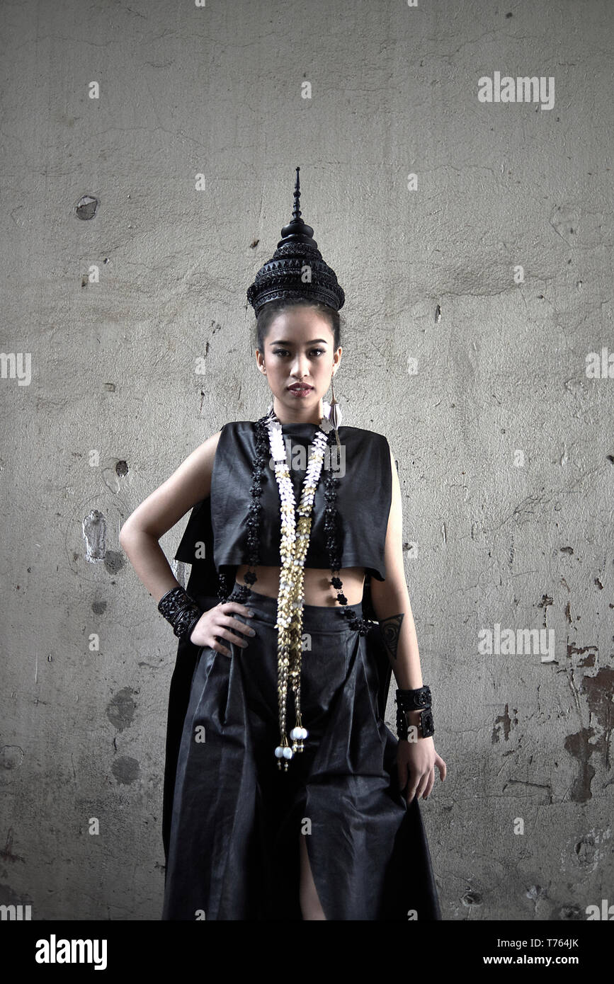 Thai female model posing in traditional Thai clothing during a fashion